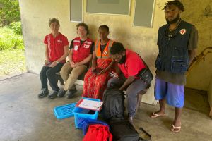 Red Cross personnel checking all materials have been delivered