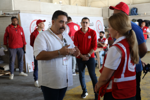 Kelsey Lemon receiving a tour of Egyptian Red Crescent logistics hub from Lotfy Gheith.