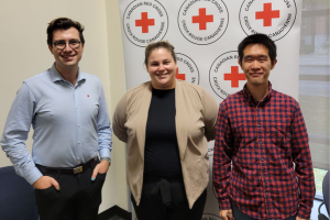 Three interns volunteering at the Kingston conference on October 26, 2023.