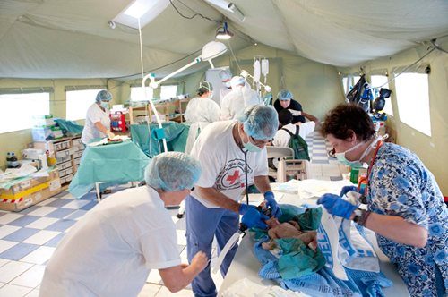 Delivery of the first baby at the Red Cross field hospital in Port-au-Prince, Haiti