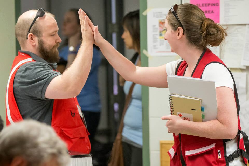 Two CRC Volunteers high fiving